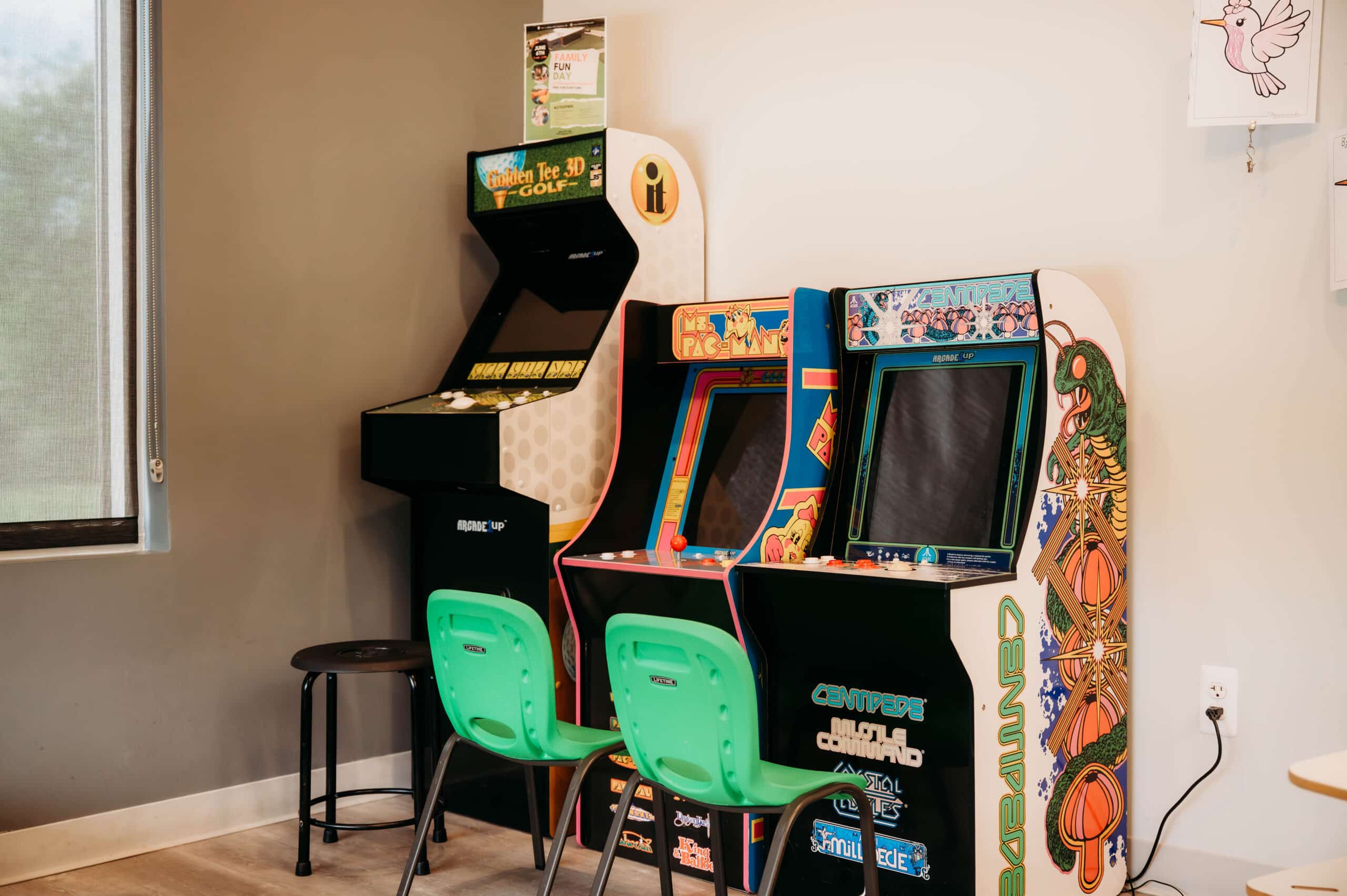 Vintage arcade games in the patient waiting area creating a fun and welcoming environment for young patients at DeHaan Orthodontics in Lake Orion, MI